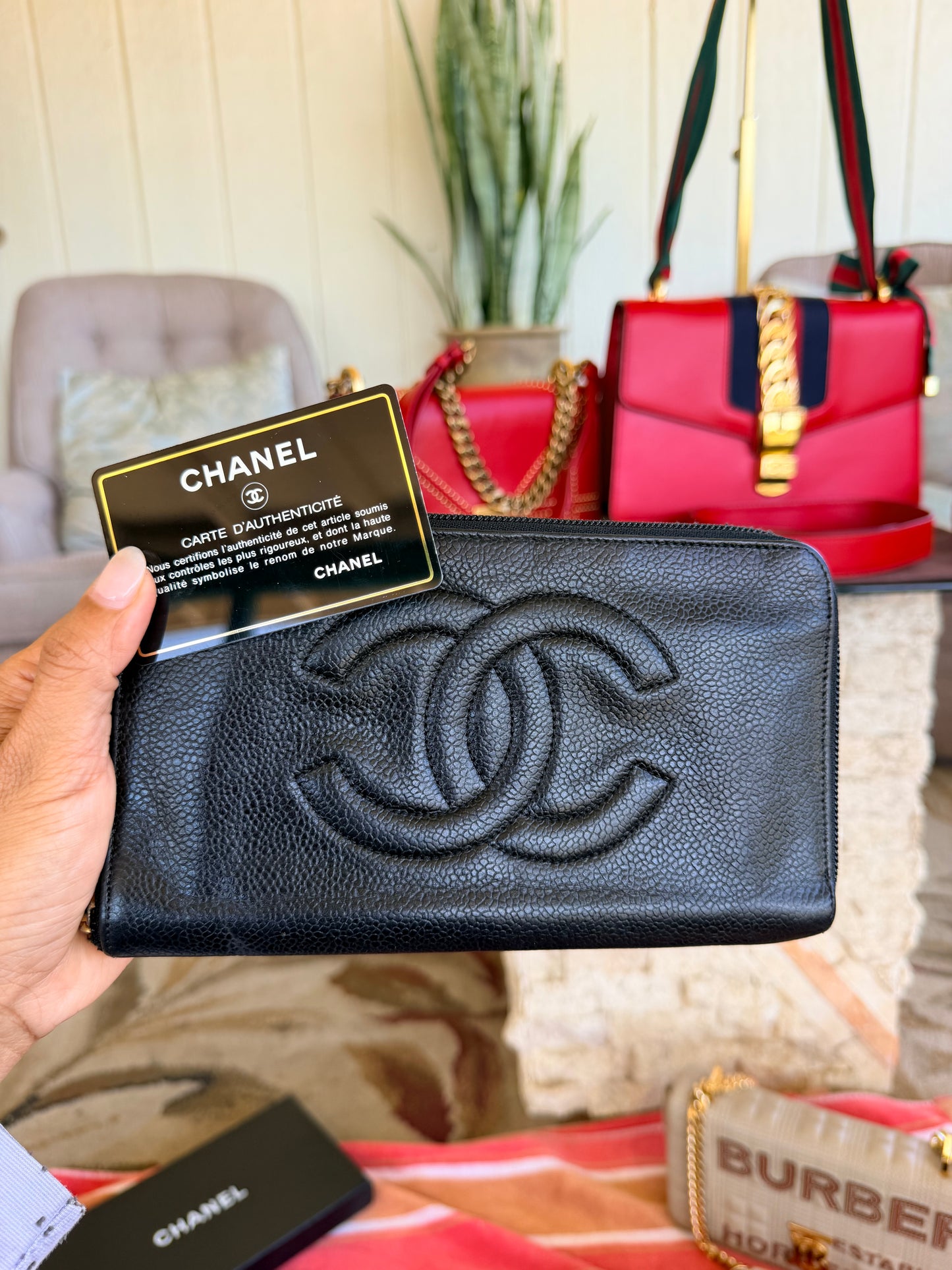 Chanel CC Zipped Wallet in Black Caviar Leather.