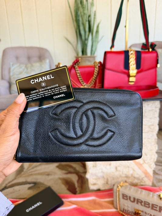Chanel CC Zipped Wallet in Black Caviar Leather.