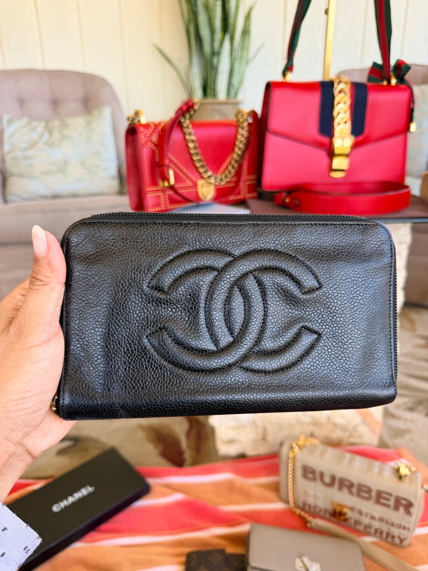 Chanel CC Zipped Wallet in Black Caviar Leather.