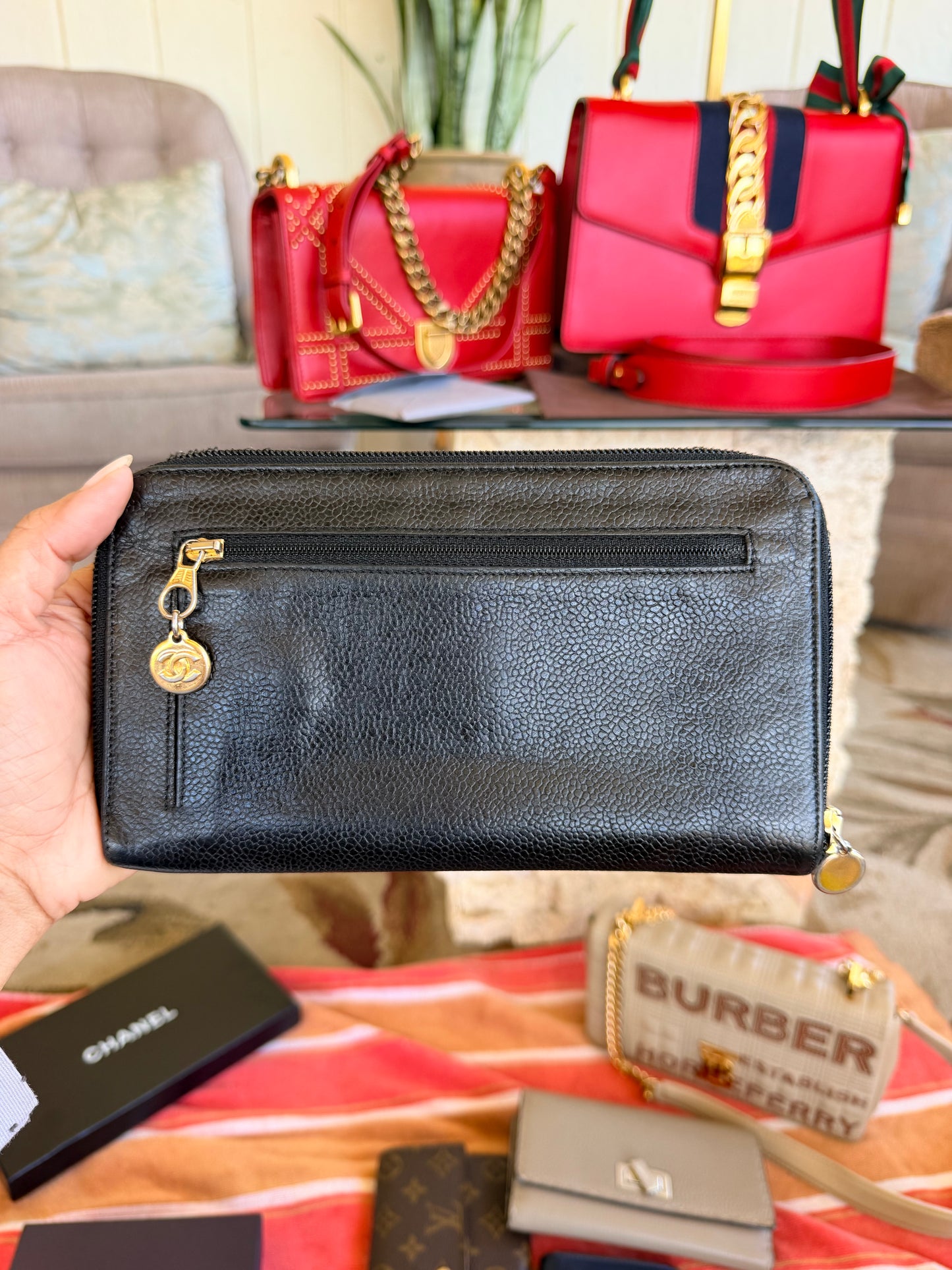Chanel CC Zipped Wallet in Black Caviar Leather.