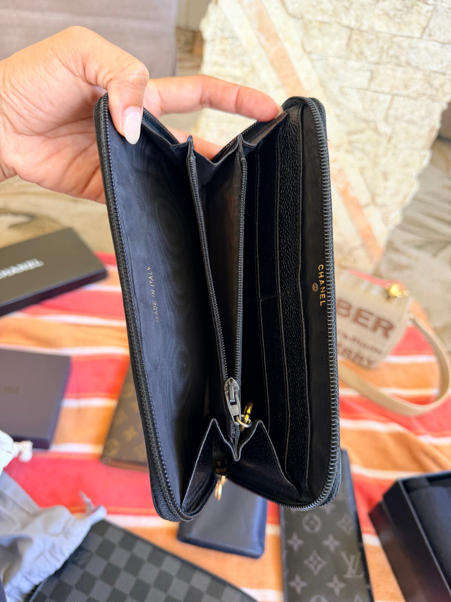 Chanel CC Zipped Wallet in Black Caviar Leather.