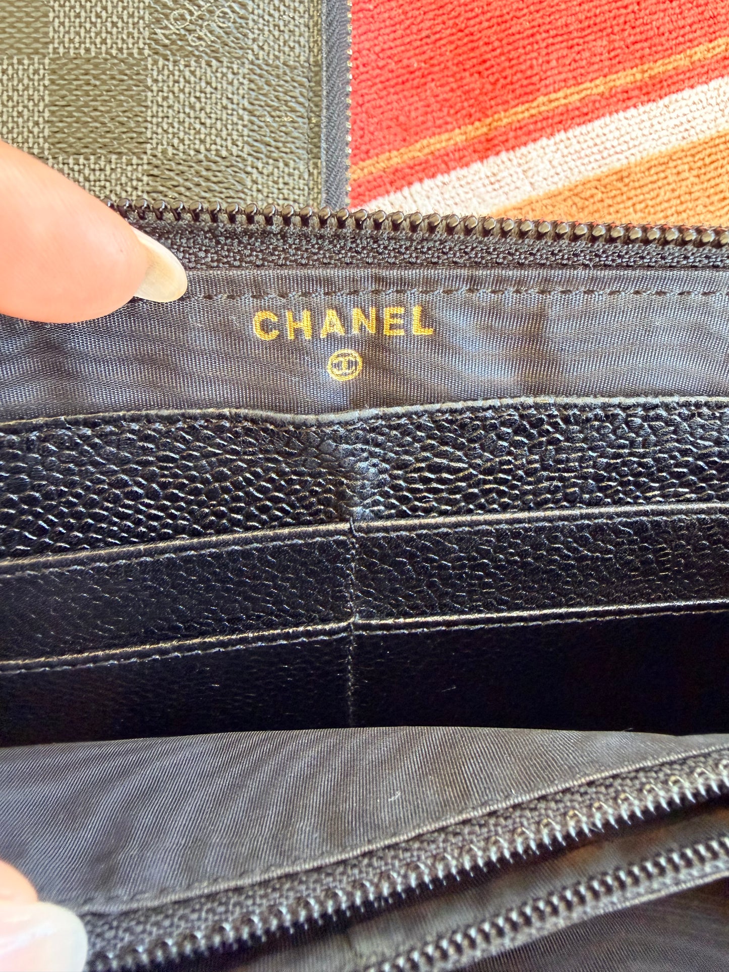 Chanel CC Zipped Wallet in Black Caviar Leather.